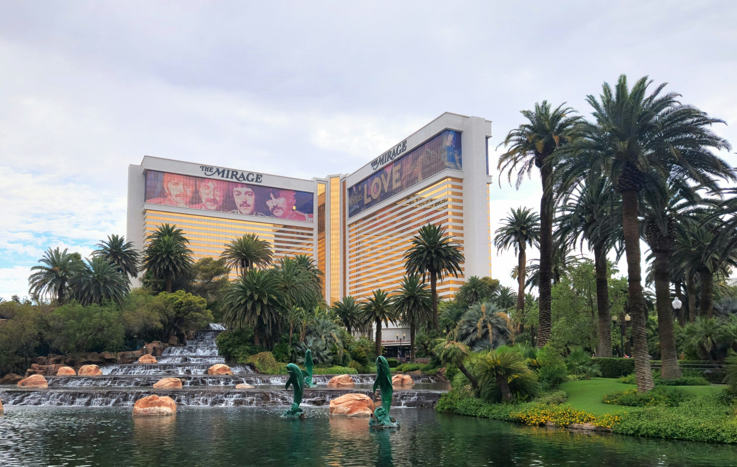 A view of a hotel from across a pond